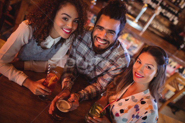 Portrait of young friends having drinks Stock photo © wavebreak_media