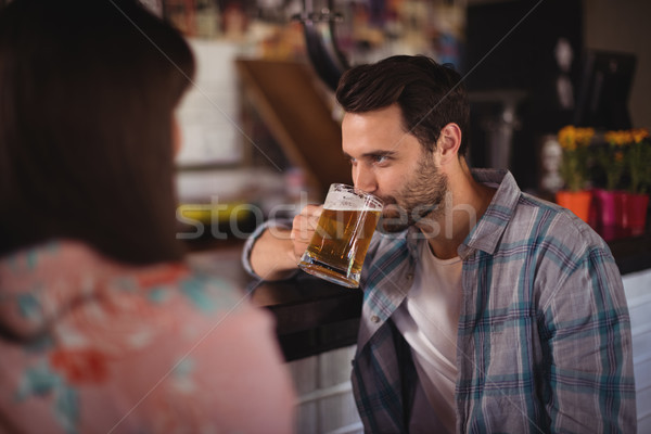 Couple having beer at counter Stock photo © wavebreak_media