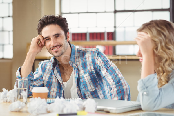 Portrait of man with tensed colleague Stock photo © wavebreak_media