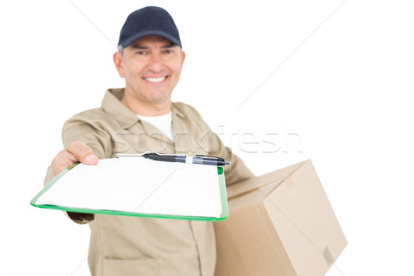 Delivery man with package giving clipboard for signature Stock photo © wavebreak_media