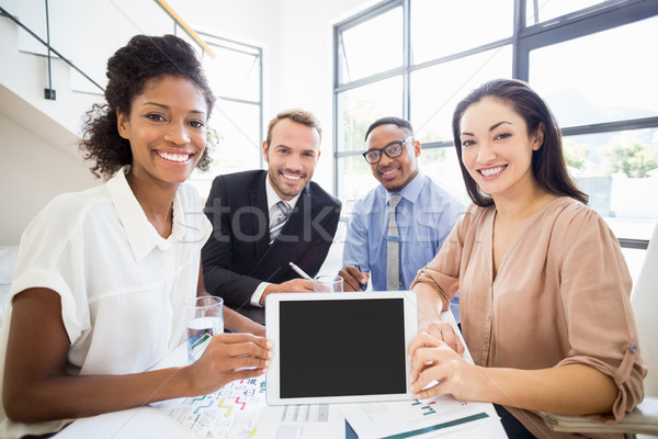 Portrait of businesspeople holding a digital tablet during a mee Stock photo © wavebreak_media