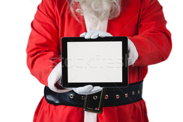 Santa claus holding digital tablet on white background Stock photo © wavebreak_media