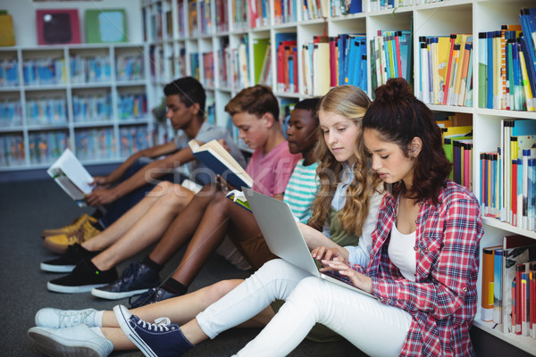 Atento estudantes estudar biblioteca escolas menina Foto stock © wavebreak_media