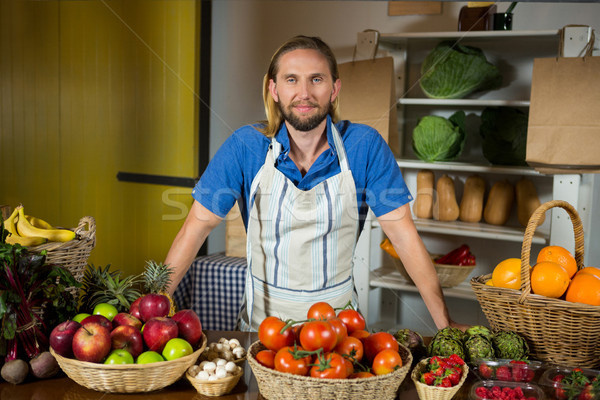 Male staff standing near vegetable counter at organic section in market Stock photo © wavebreak_media