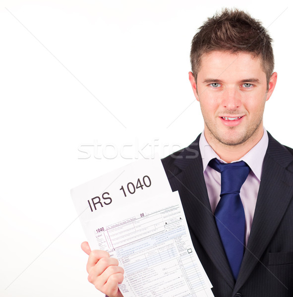 Man holding out his irs returns form Stock photo © wavebreak_media