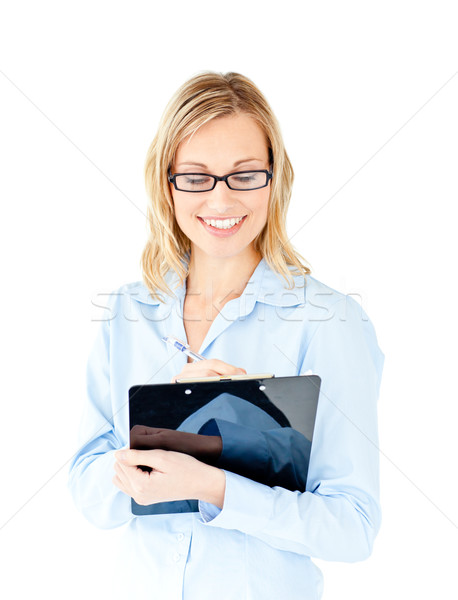 Confident businesswoman taking notes on a clipboard against a white background Stock photo © wavebreak_media