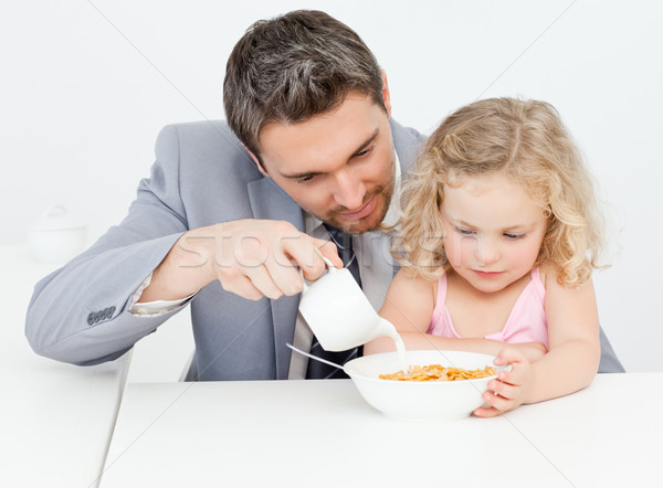 Father having breakfast with her daughter at home Stock photo © wavebreak_media