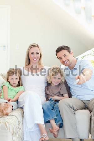 Famille ensemble canapé fille sourire [[stock_photo]] © wavebreak_media