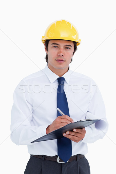 Male architect with clipboard and pen against a white background Stock photo © wavebreak_media