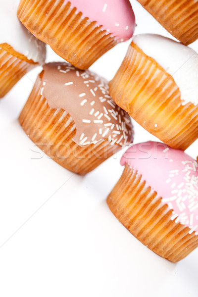 Közelkép sok muffinok porcukor fehér háttér Stock fotó © wavebreak_media