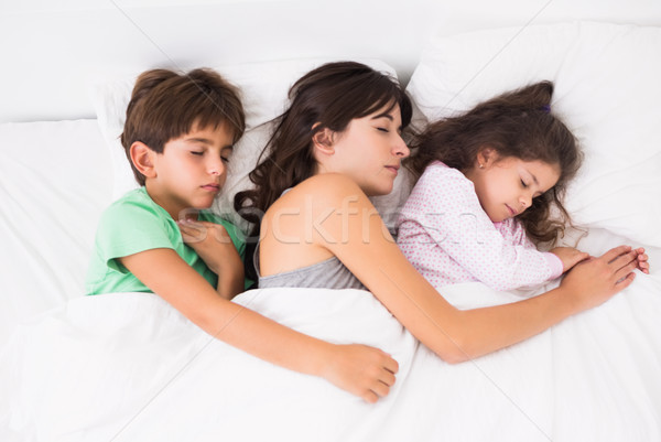 Mother asleep with her children Stock photo © wavebreak_media