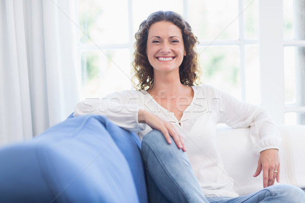 Pretty brunette relaxing on the couch  Stock photo © wavebreak_media