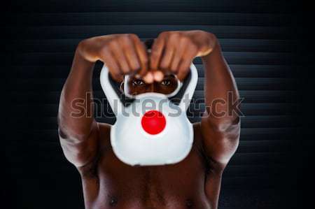 Composite image of bodybuilder holding kettlebell Stock photo © wavebreak_media