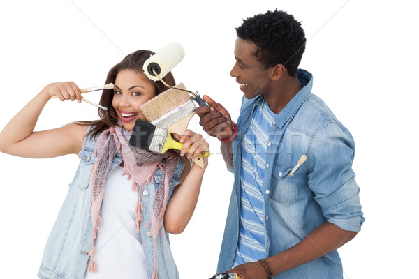 Portrait of a happy couple with painting tools Stock photo © wavebreak_media