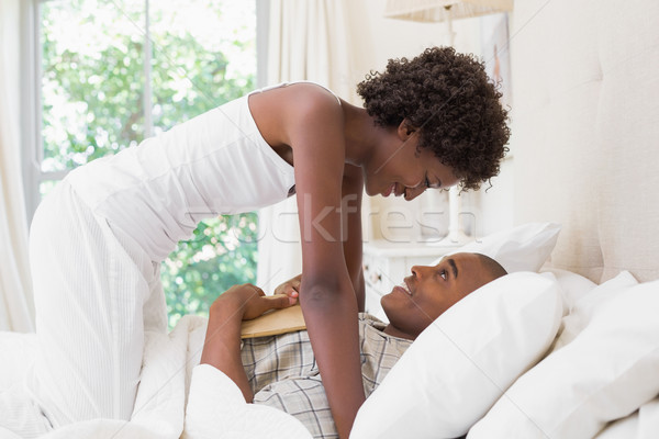 Intimate couple messing about in the morning on bed Stock photo © wavebreak_media