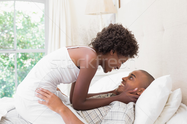 Intimate couple messing about in the morning on bed Stock photo © wavebreak_media