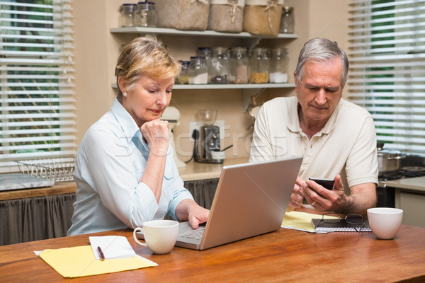 Senior couple working out their bills Stock photo © wavebreak_media