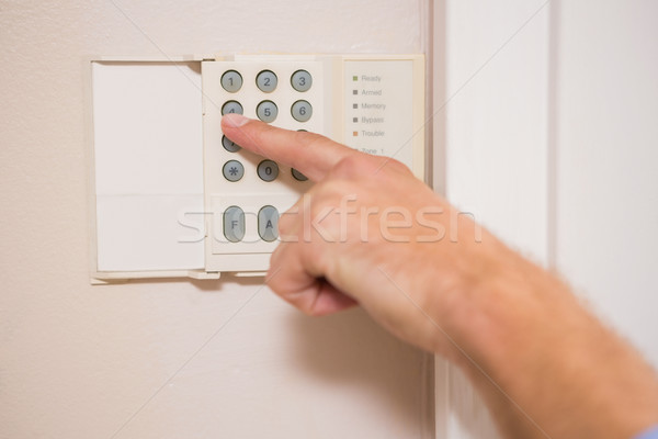 Man arming a home alarm Stock photo © wavebreak_media