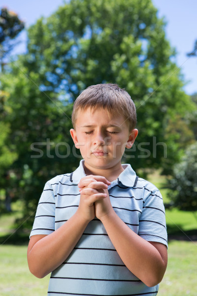 Little boy saying his prayers Stock photo © wavebreak_media