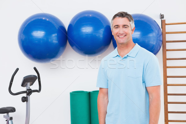 улыбаясь человека глядя камеры фитнес студию Сток-фото © wavebreak_media