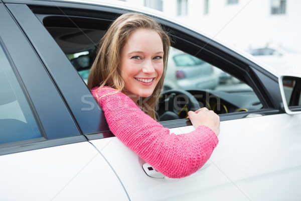 Young woman smiling at camera  Stock photo © wavebreak_media