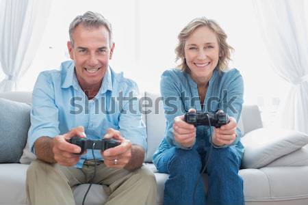 Happy family with two children playing video games Stock photo © wavebreak_media