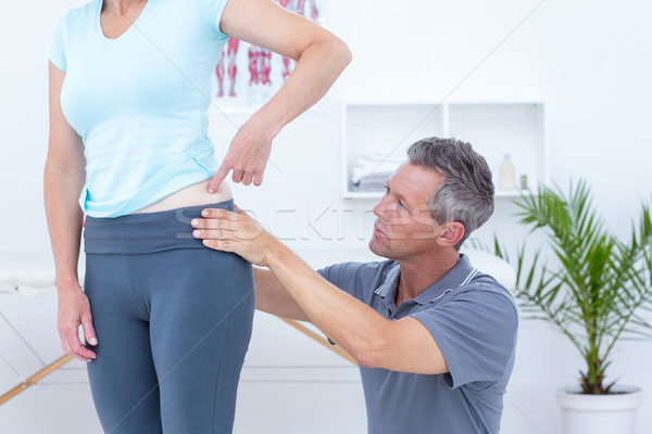 Physiotherapist examining his patient back  Stock photo © wavebreak_media