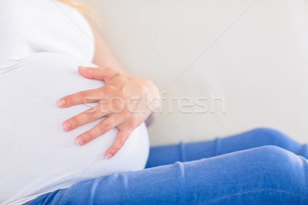 Közelkép terhes nő egy kéz has ház Stock fotó © wavebreak_media