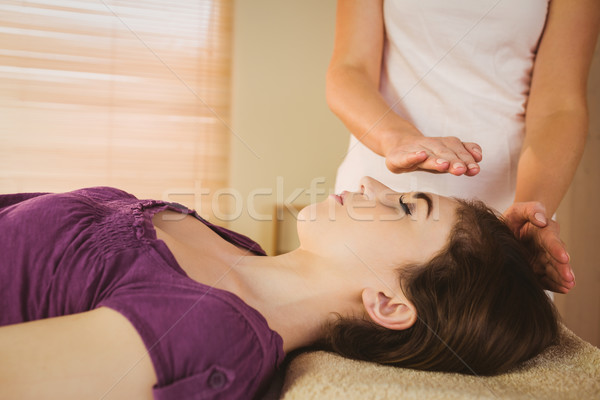 Young woman having a reiki treatment Stock photo © wavebreak_media