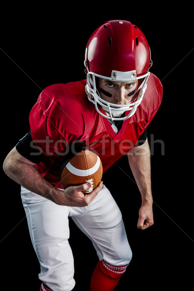 Portrait of focused american football player being ready to atta Stock photo © wavebreak_media