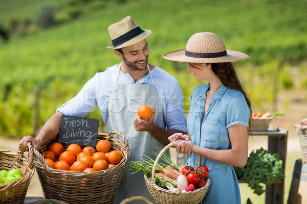 Woman buying fresh fruit from vendor Stock photo © wavebreak_media