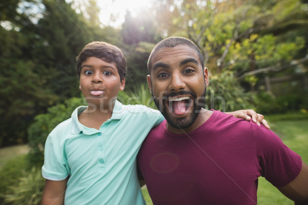 Mischievous father and son enjoying at park Stock photo © wavebreak_media