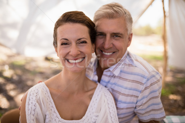 Portrait of happy couple sitting in cottage Stock photo © wavebreak_media