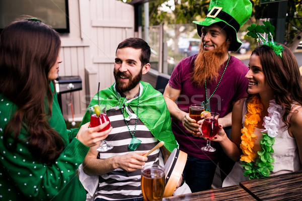 [[stock_photo]]: Amis · célébrer · jour · de · St · Patrick · boissons · bar · femme