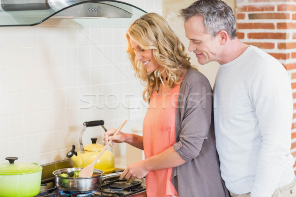 Cute couple cooking Stock photo © wavebreak_media