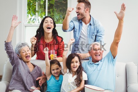 Glückliche Familie Fernsehen Sitzung Sofa Wohnzimmer Mädchen Stock foto © wavebreak_media