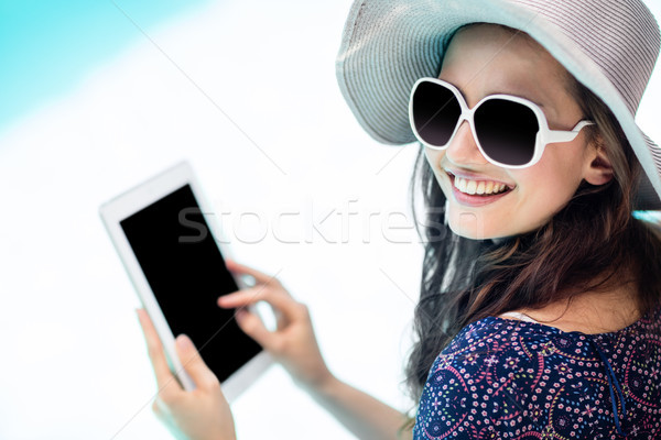 Woman using her tablet  Stock photo © wavebreak_media