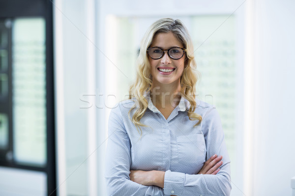 Beautiful customer standing in optical store Stock photo © wavebreak_media