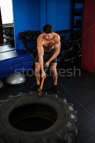 Young man exercising with sledgehammer  Stock photo © wavebreak_media