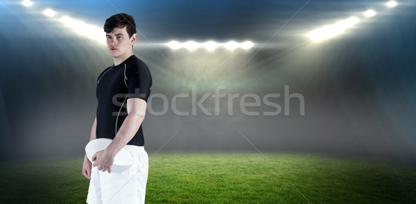 Composite image of rugby player holding a rugby ball Stock photo © wavebreak_media