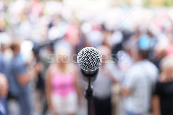 Microphone in focus against blurred audience Stock photo © wellphoto