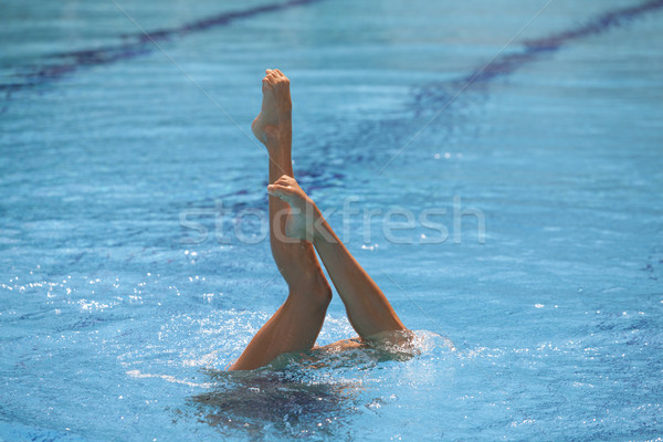 пловец ног точки вверх из воды Сток-фото © wellphoto