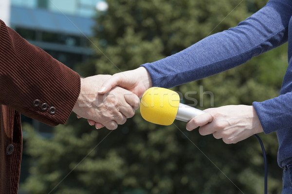 Handshake before media interview Stock photo © wellphoto