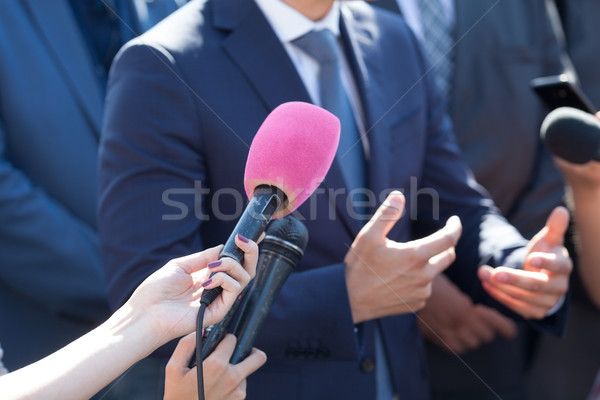 Media interview. Hand gesture. Business person or politician. Stock photo © wellphoto