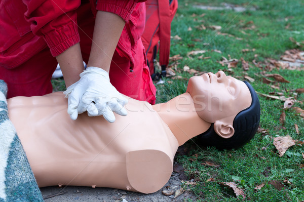 Paramedic demonstrate Cardiopulmonary resuscitation - CPR on dummy Stock photo © wellphoto