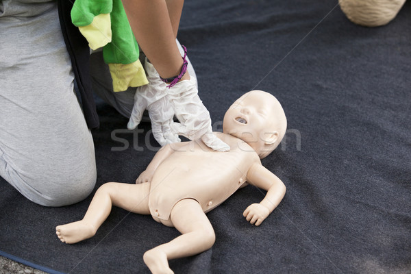 Infant dummy cardiac massage Stock photo © wellphoto