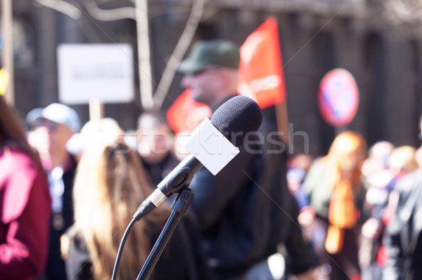 Political protest. Demonstration. Microphone in focus, blurred p Stock photo © wellphoto