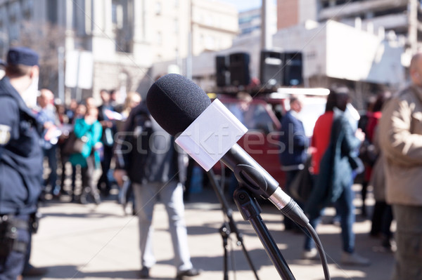 Protest. Demonstration. Microphone in focus, blurred protesters  Stock photo © wellphoto