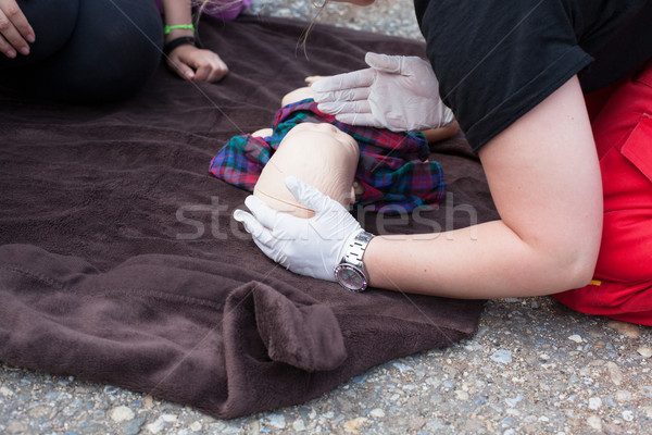 Infant dummy first aid. CPR. Stock photo © wellphoto