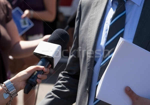 Stock photo: Journalist making media interview with businessman 